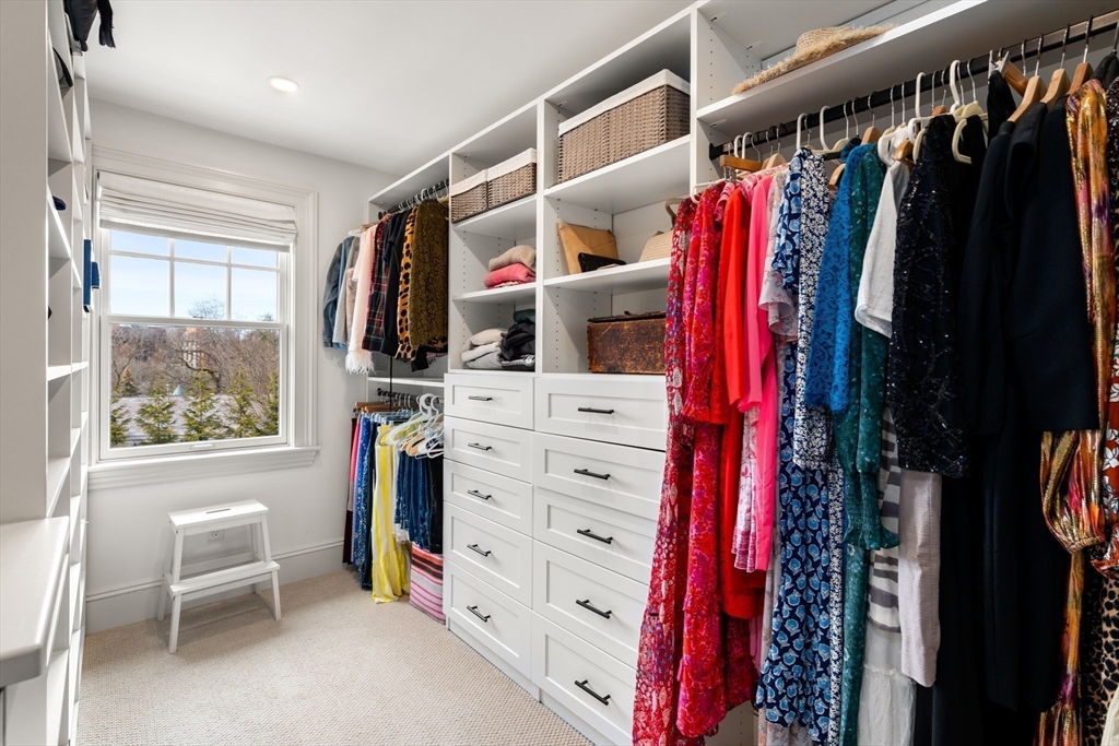 3 Cleveland Road Brookline, MA 02445 - Photo 22 of 27 a view of walk in closet with clothes and shoes