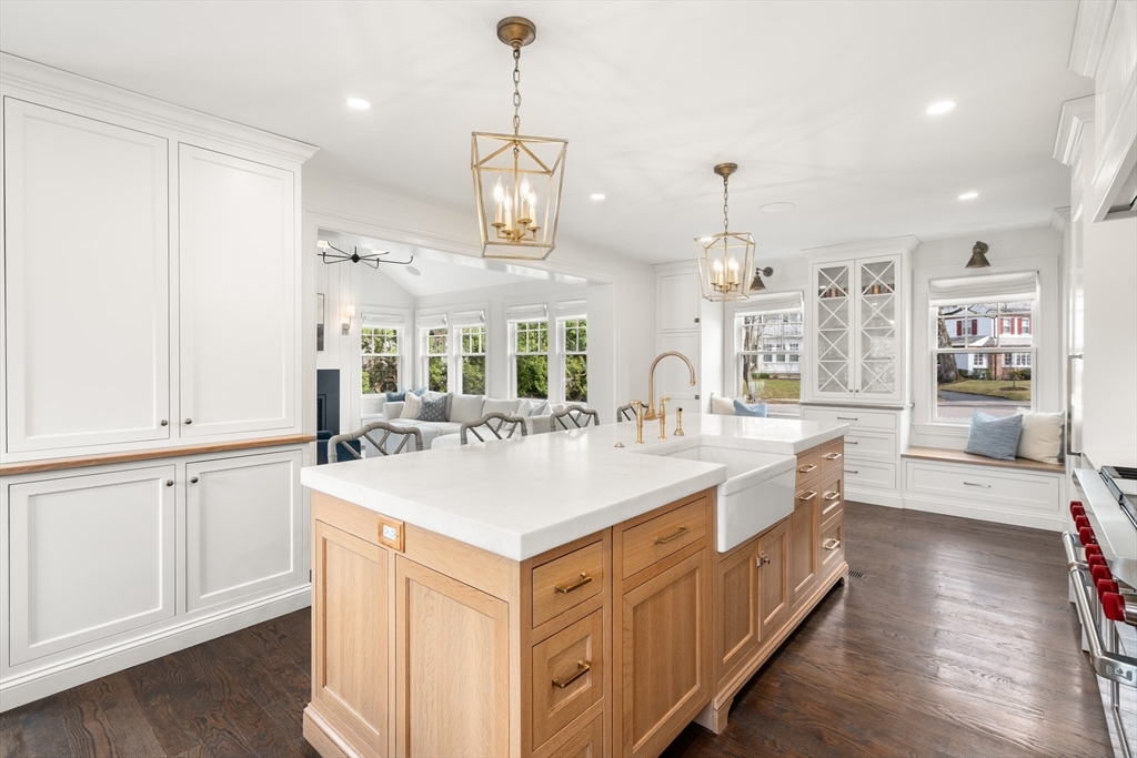 3 Cleveland Road Brookline, MA 02445 - Photo 3 of 27 a large kitchen with kitchen island a stove a sink a center island and a wooden floor