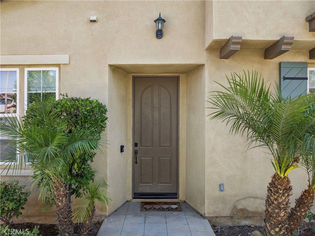 4155 Windspring Street Corona, CA 92883 - Photo 6 of 38 a front view of a house with a yard