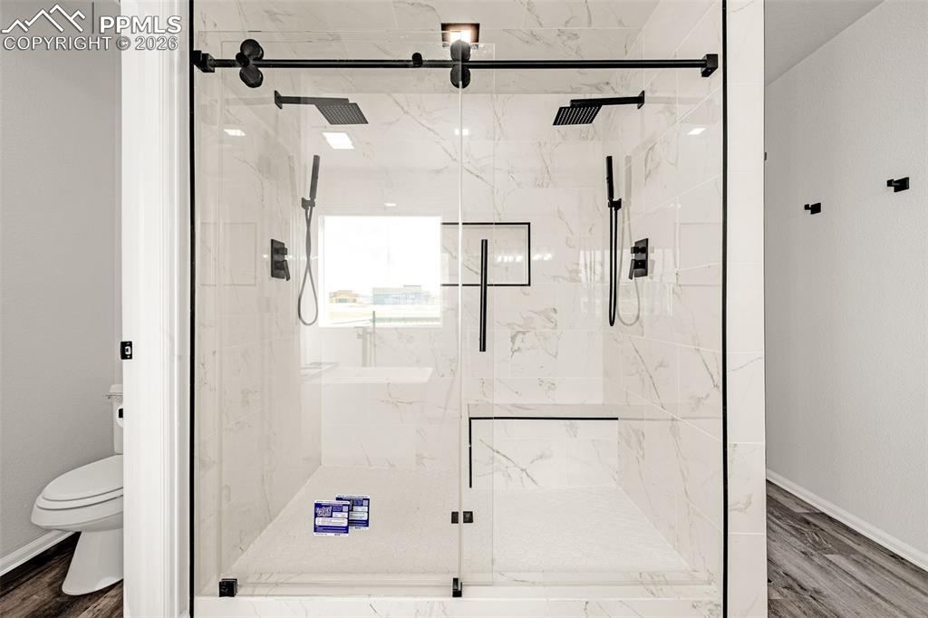 8388 Fort Smith Road Peyton, CO 80831 - Photo 12 of 49 a bathroom with a shower and toilet