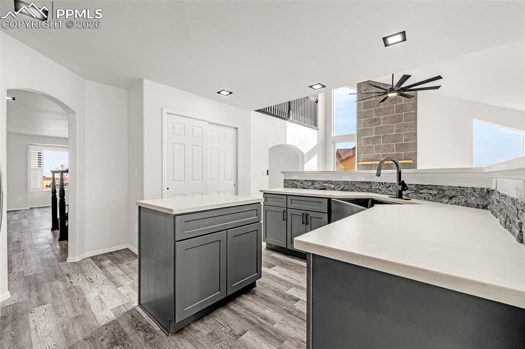 8388 Fort Smith Road Peyton, CO 80831 - Photo 14 of 49 a kitchen with a sink and a stove top oven