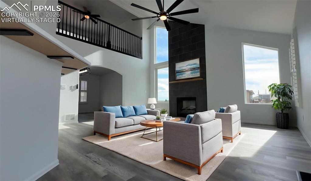 8388 Fort Smith Road Peyton, CO 80831 - Photo 19 of 49 a living room with furniture and a fireplace