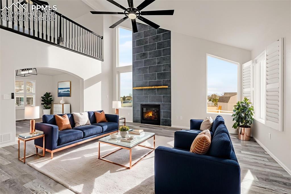 8388 Fort Smith Road Peyton, CO 80831 - Photo 21 of 49 a living room with furniture and a fireplace