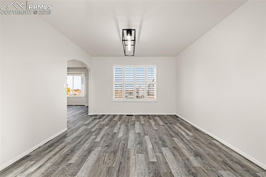 8388 Fort Smith Road Peyton, CO 80831 - Photo 25 of 49 wooden floor in an empty room with a window