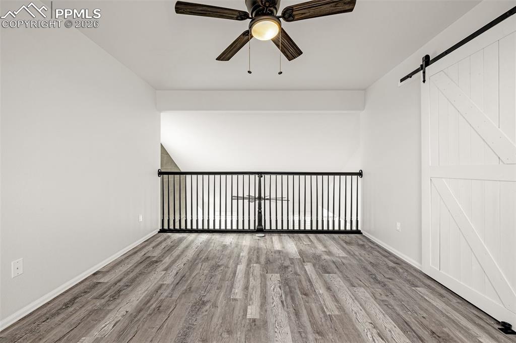 8388 Fort Smith Road Peyton, CO 80831 - Photo 30 of 49 a view of a hallway with a wooden floor