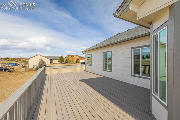 a view of a balcony with wooden floor