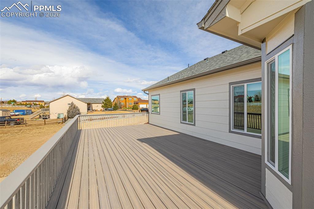 8388 Fort Smith Road Peyton, CO 80831 - Photo 3 of 49 a view of a balcony with wooden floor