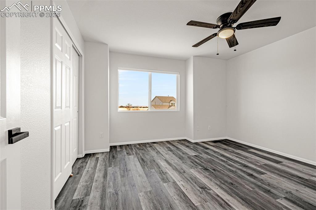 8388 Fort Smith Road Peyton, CO 80831 - Photo 32 of 49 wooden floor in an empty room