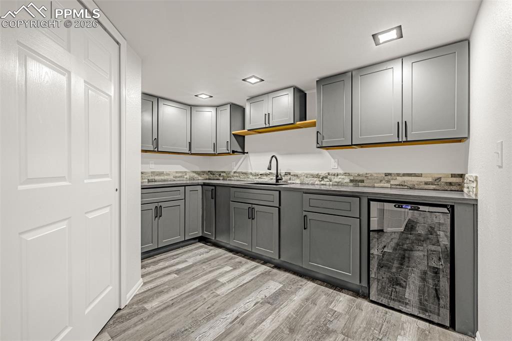 8388 Fort Smith Road Peyton, CO 80831 - Photo 36 of 49 a kitchen with a refrigerator sink and cabinets