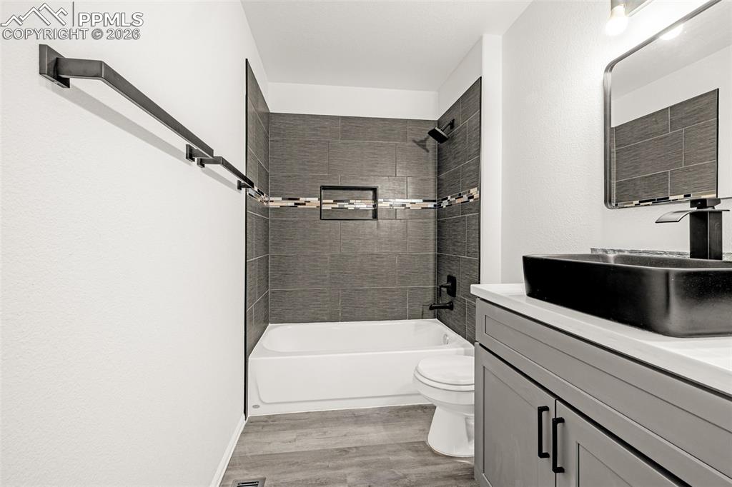 8388 Fort Smith Road Peyton, CO 80831 - Photo 37 of 49 a bathroom with a toilet a sink and a bathtub