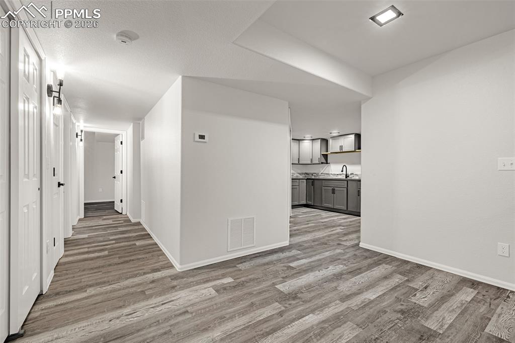 8388 Fort Smith Road Peyton, CO 80831 - Photo 38 of 49 a view of a kitchen with wooden floor and a sink