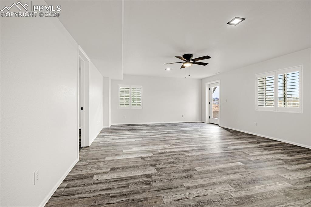8388 Fort Smith Road Peyton, CO 80831 - Photo 39 of 49 wooden floor in an empty room with a window
