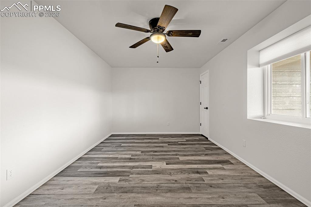 8388 Fort Smith Road Peyton, CO 80831 - Photo 44 of 49 a view of empty room with window and ceiling fan
