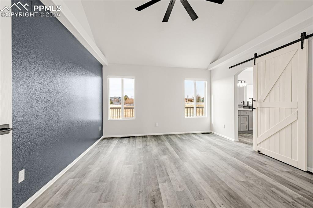 8388 Fort Smith Road Peyton, CO 80831 - Photo 10 of 49 wooden floor in an empty room with a window