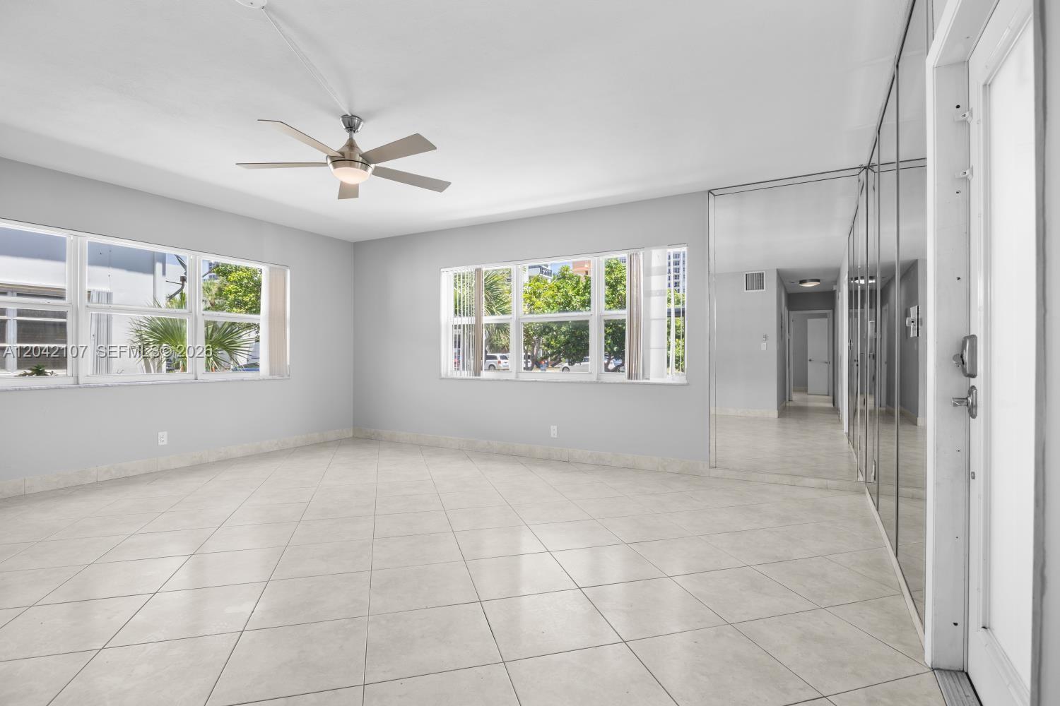 3213 Colony Club Road, Unit 3E Pompano Beach, FL 33062 - Photo 6 of 31 a view of an empty room with a window
