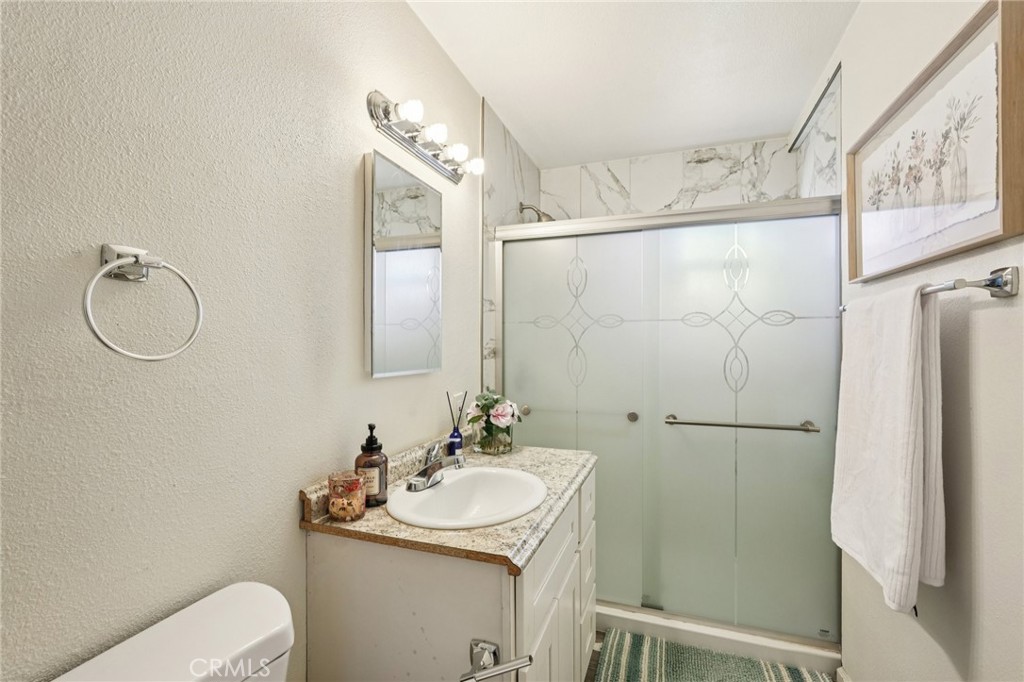 975 Brookside Avenue Redlands, CA 92373 - Photo 12 of 20 a bathroom with a sink toilet and shower