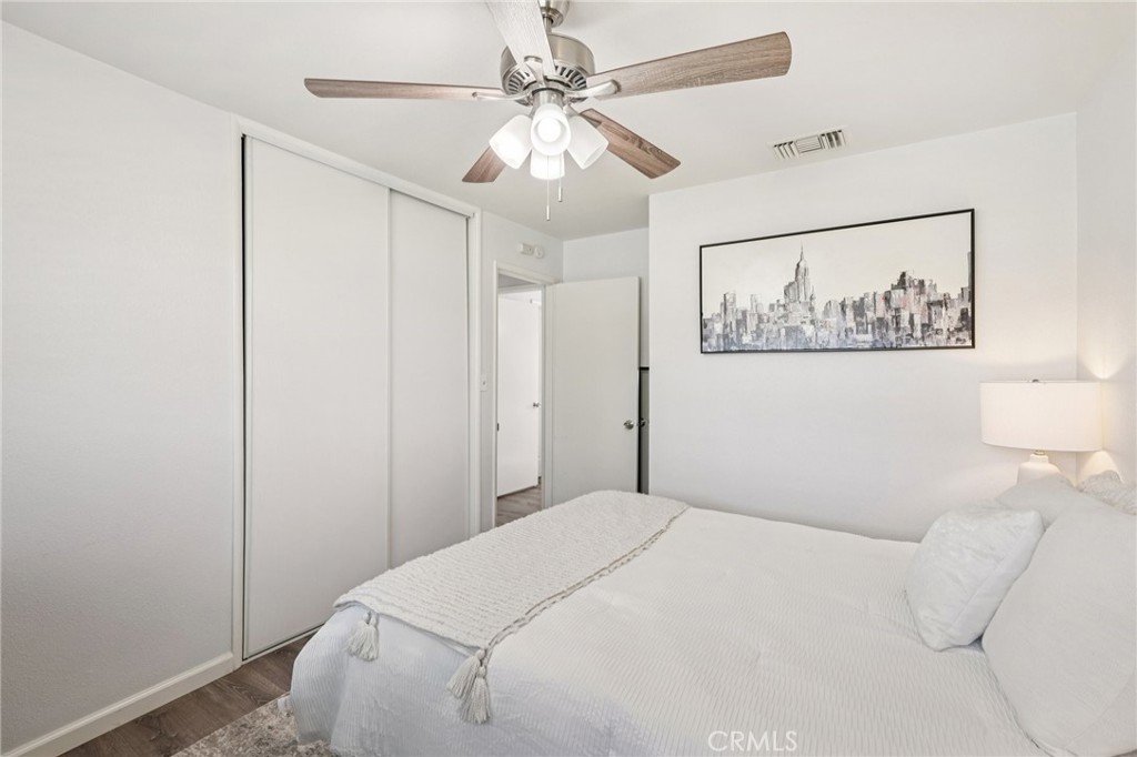 975 Brookside Avenue Redlands, CA 92373 - Photo 16 of 20 a bedroom with a bed and a painting on the wall