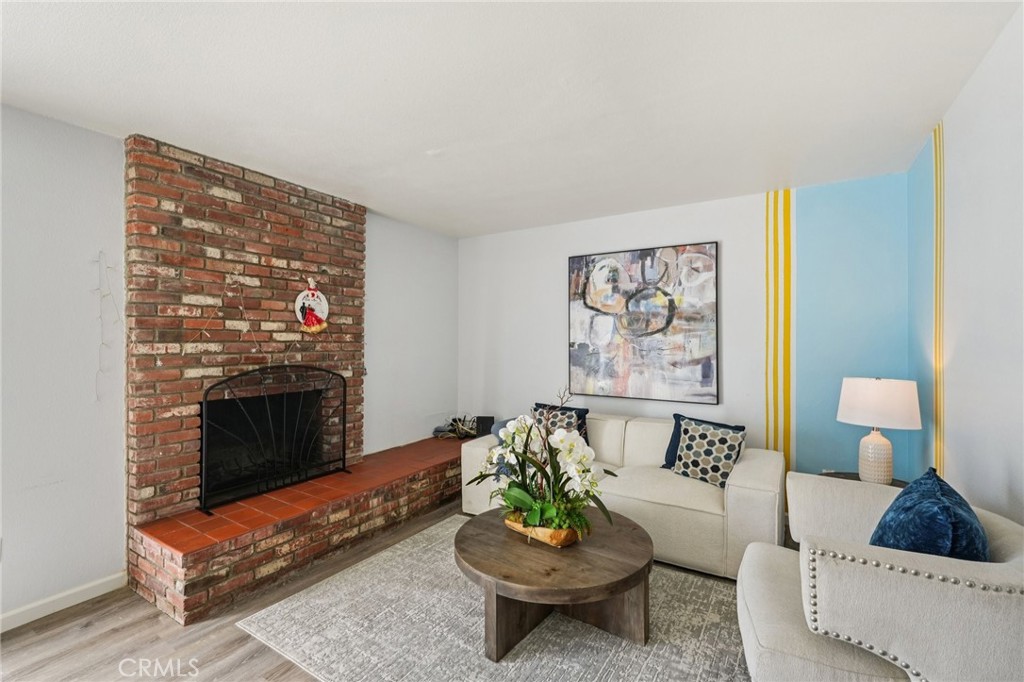 975 Brookside Avenue Redlands, CA 92373 - Photo 2 of 20 a living room with furniture and a fireplace