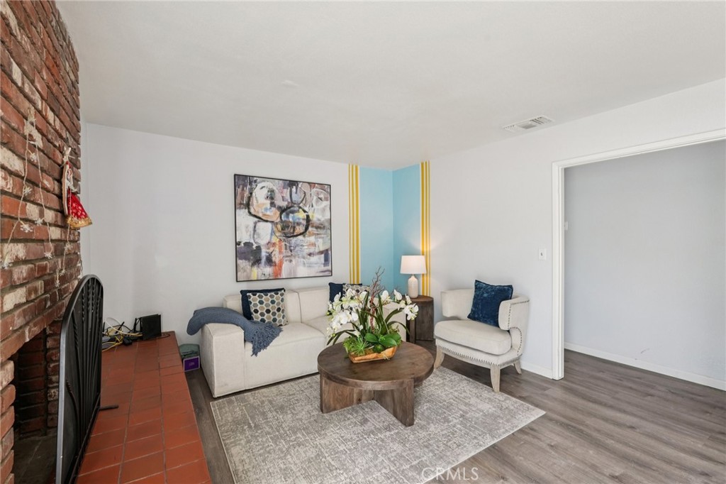 975 Brookside Avenue Redlands, CA 92373 - Photo 3 of 20 a living room with furniture and a potted plant
