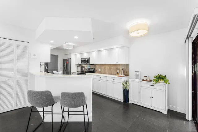 a kitchen with appliances and cabinets