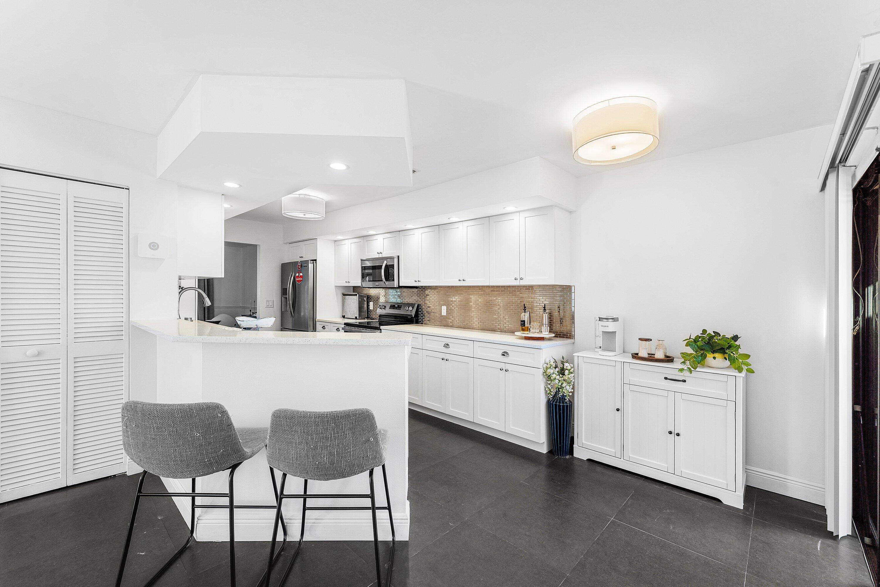 19931 Villa Lante Place Boca Raton, FL 33434 - Photo 14 of 49 a kitchen with appliances and cabinets