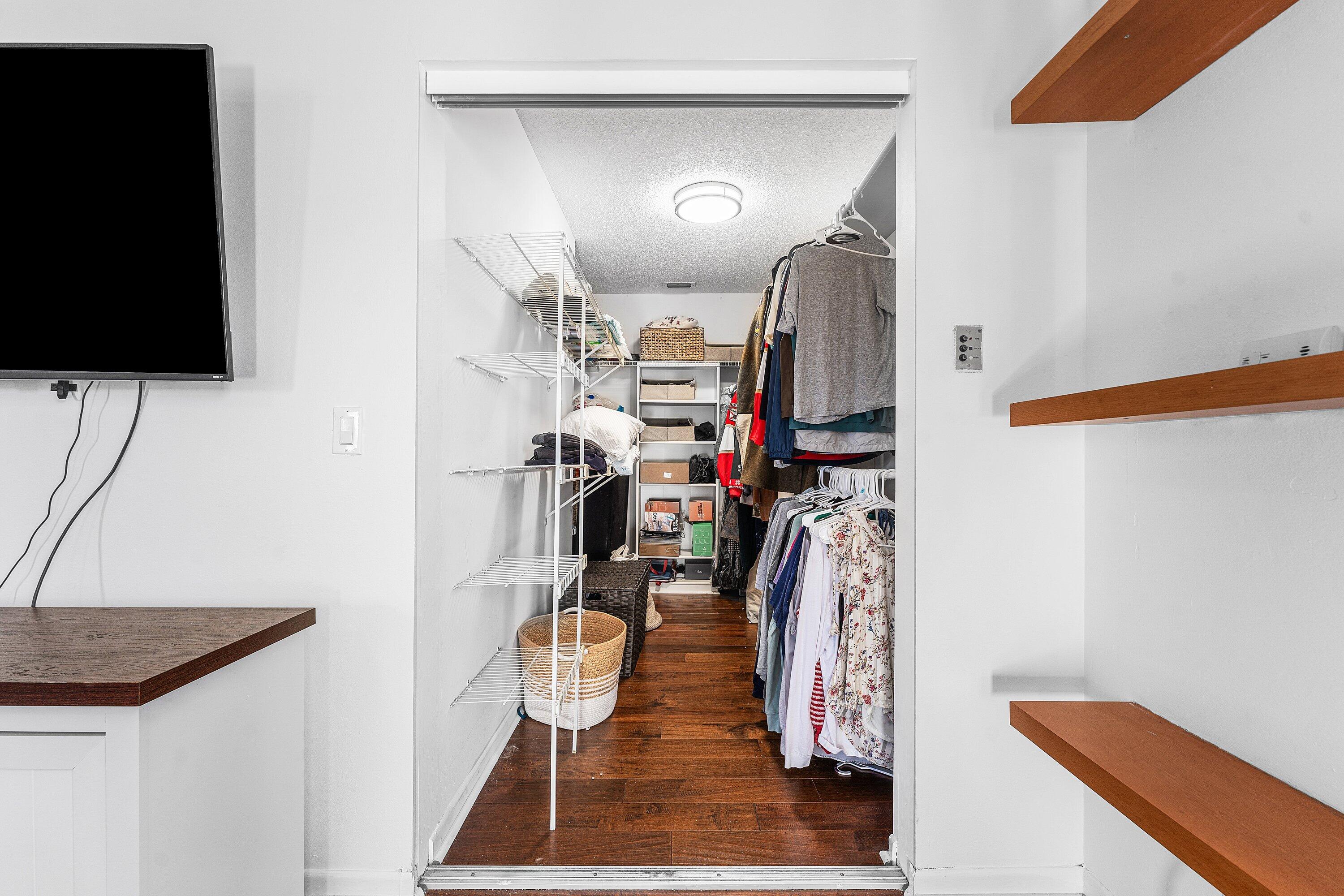 19931 Villa Lante Place Boca Raton, FL 33434 - Photo 25 of 49 a view of walk in closet with clothes and shoes