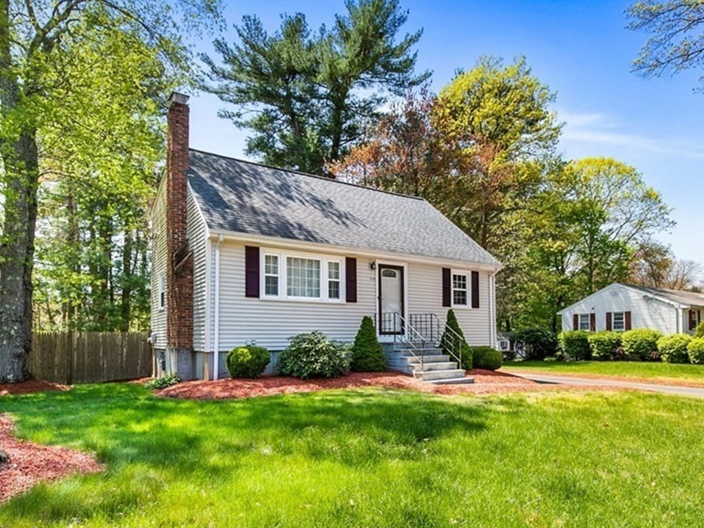 119 Spallus Road Stoughton, MA 02072 - Photo 1 of 38 a front view of a house with a yard and green space