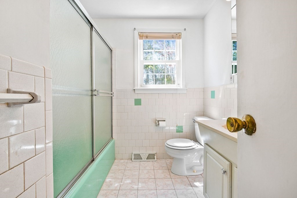 119 Spallus Road Stoughton, MA 02072 - Photo 10 of 38 a bathroom with a toilet and a shower