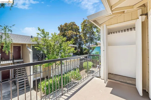 a view of a balcony with wooden floor