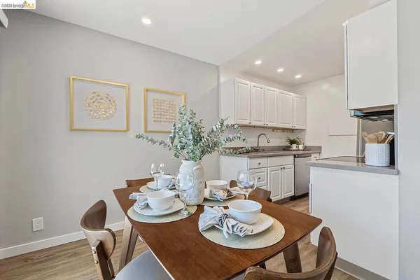 a kitchen with a table and chairs in it