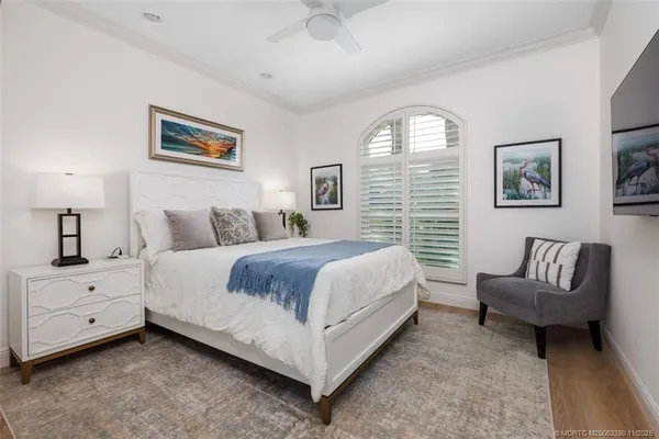 a spacious bedroom with a bed and a couch