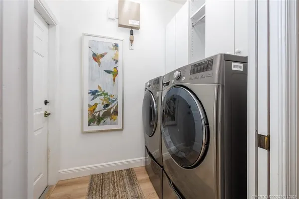 a view of hallway with washer and dryer