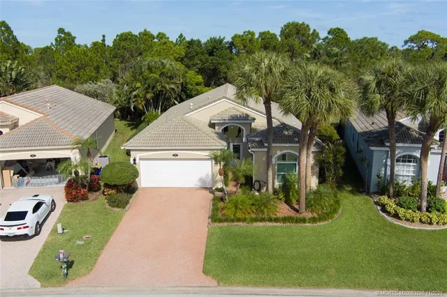 an aerial view of a house with a lake view