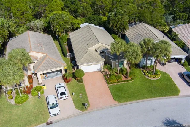an aerial view of lake residential houses with outdoor space and swimming pool