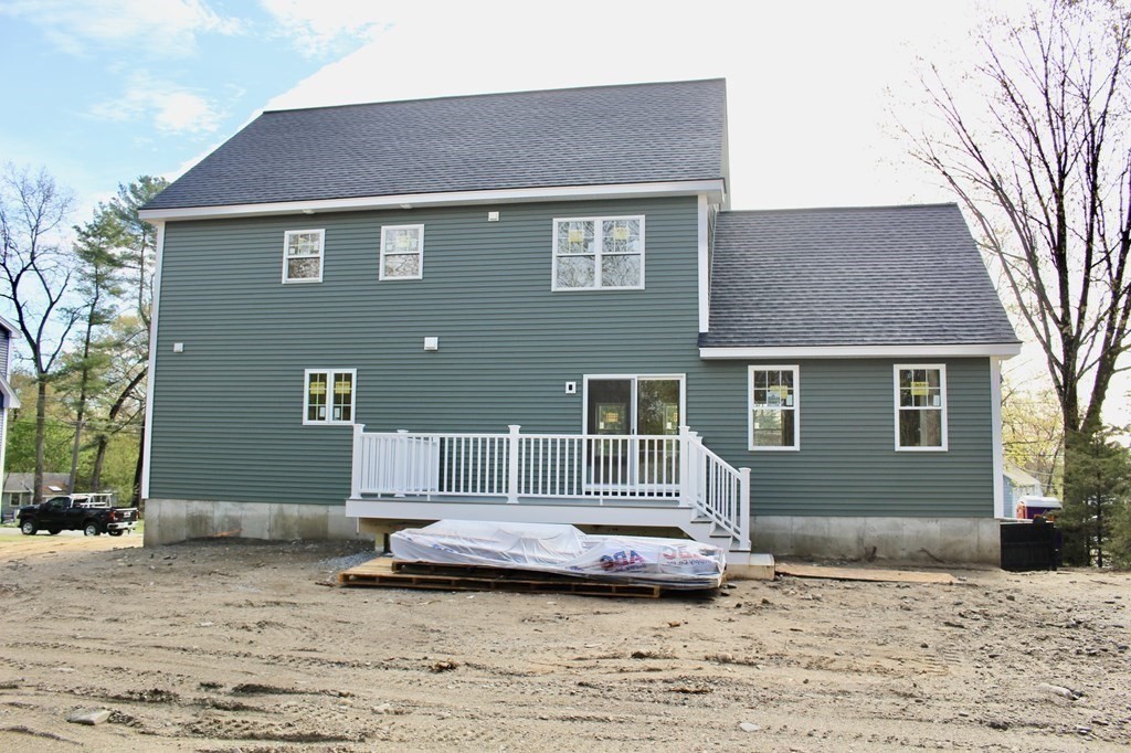26 Arcadia Road Billerica, MA 01821 - Photo 3 of 4 a house view with a garden