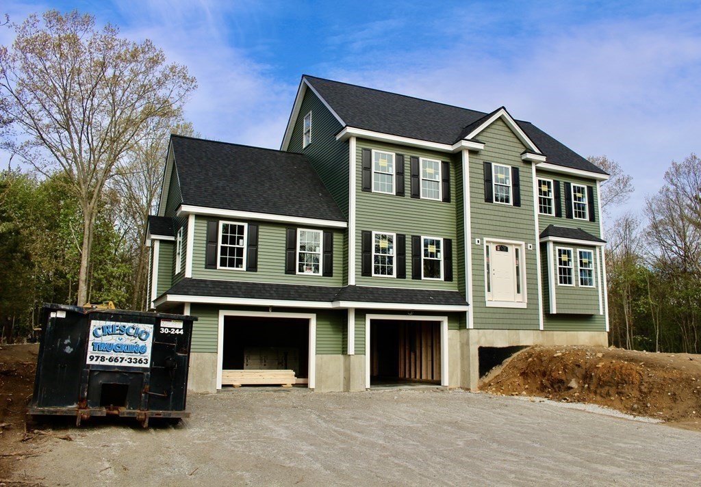 26 Arcadia Road Billerica, MA 01821 - Photo 4 of 4 a front view of a house with a yard
