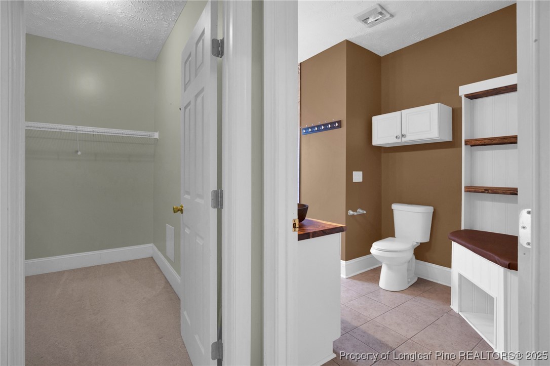 121 Shell Drive Elizabethtown, NC 28337 - Photo 22 of 36 a bathroom with a toilet and a shower