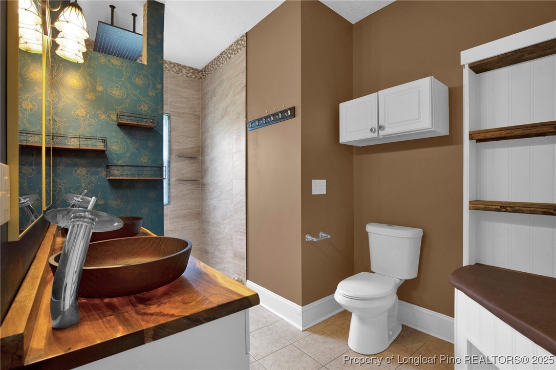 121 Shell Drive Elizabethtown, NC 28337 - Photo 23 of 36 a living room with furniture and a toilet