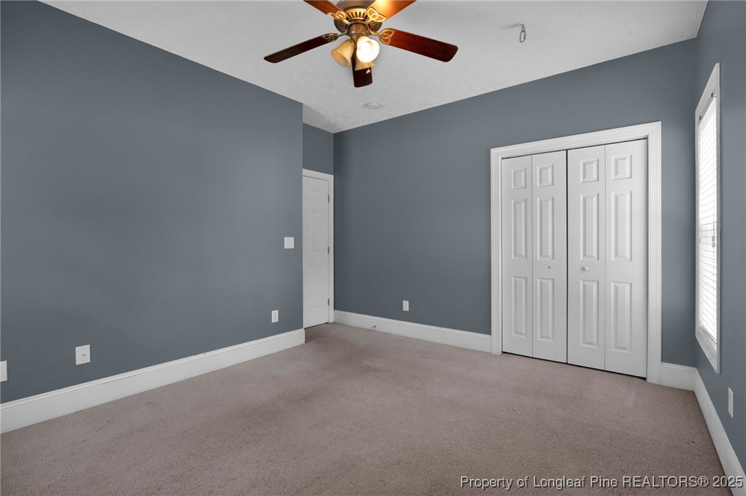 121 Shell Drive Elizabethtown, NC 28337 - Photo 26 of 36 an empty room with chandelier fan