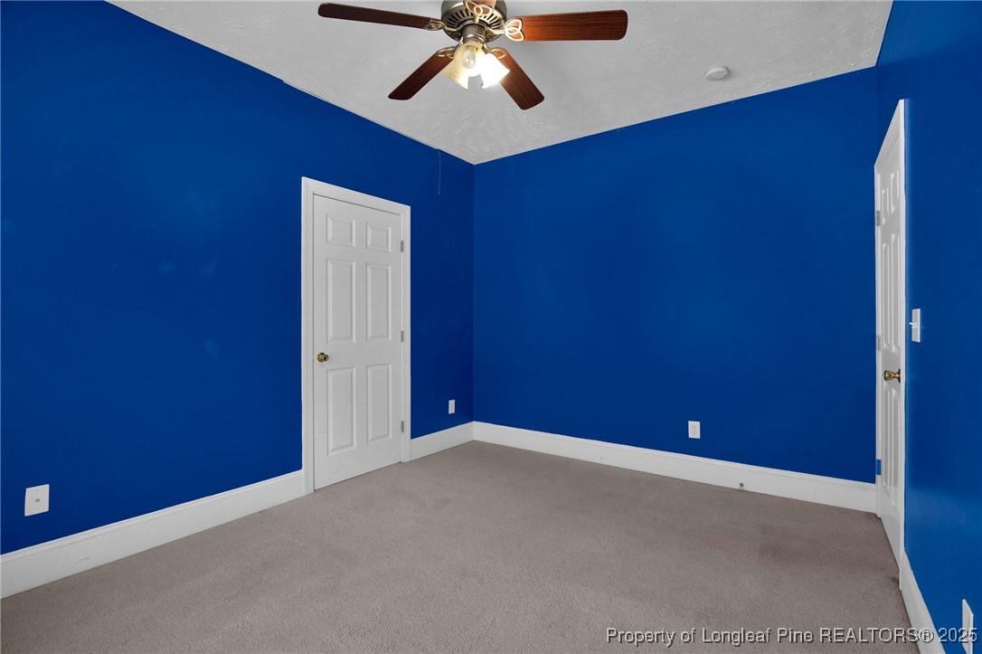121 Shell Drive Elizabethtown, NC 28337 - Photo 30 of 36 an empty room with chandelier fan