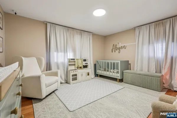 a spacious bedroom with a bed and a couch