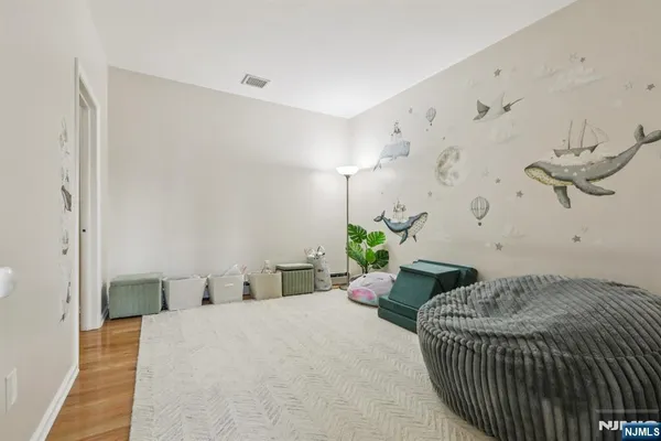 a bedroom with a bed and ceiling fan