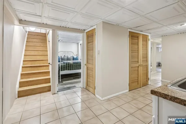 a view of a livingroom with wooden floor and closet