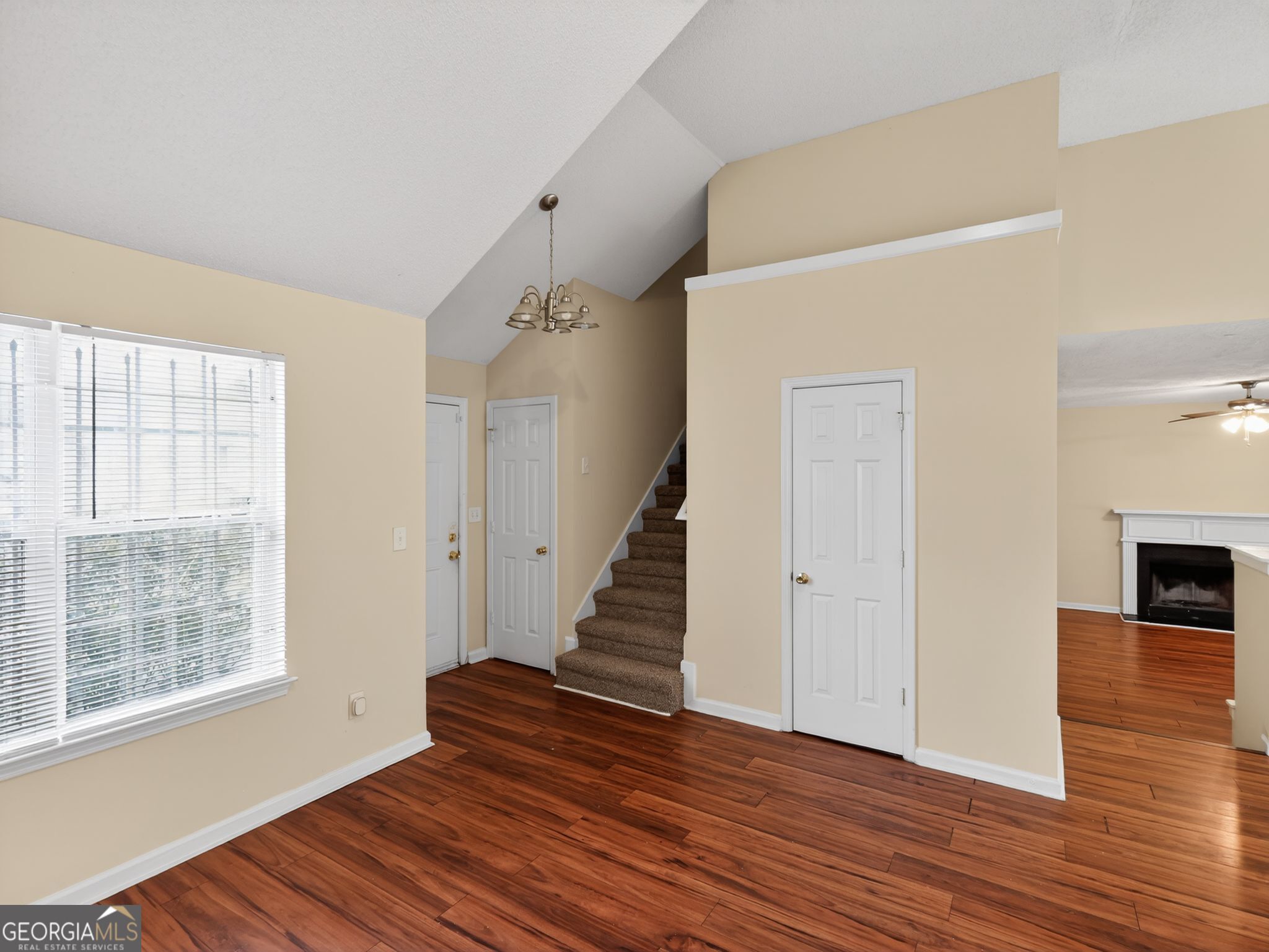 4460 Abram Way Conley, GA 30288 - Photo 2 of 29 a view of an empty room with wooden floor and a window