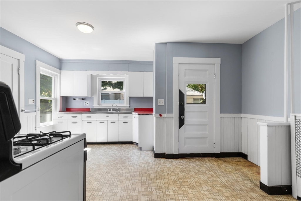 20 Marion Road Watertown, MA 02472 - Photo 15 of 33 a kitchen with a stove and a refrigerator