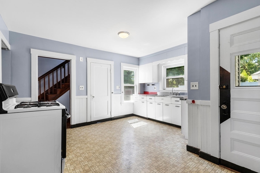 20 Marion Road Watertown, MA 02472 - Photo 18 of 33 a view of a kitchen with a sink and cabinet with wooden floor