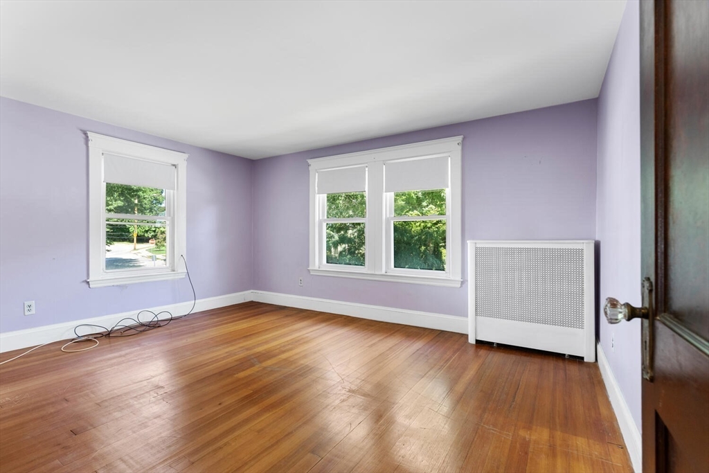 20 Marion Road Watertown, MA 02472 - Photo 19 of 33 an empty room with wooden floor and windows