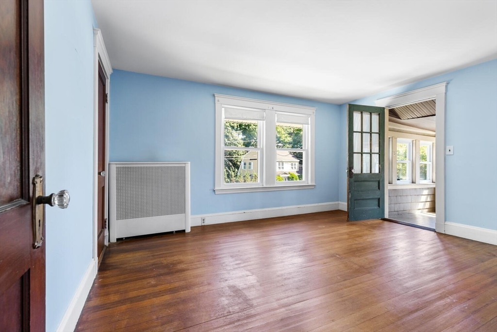 20 Marion Road Watertown, MA 02472 - Photo 23 of 33 an empty room with wooden floor and windows
