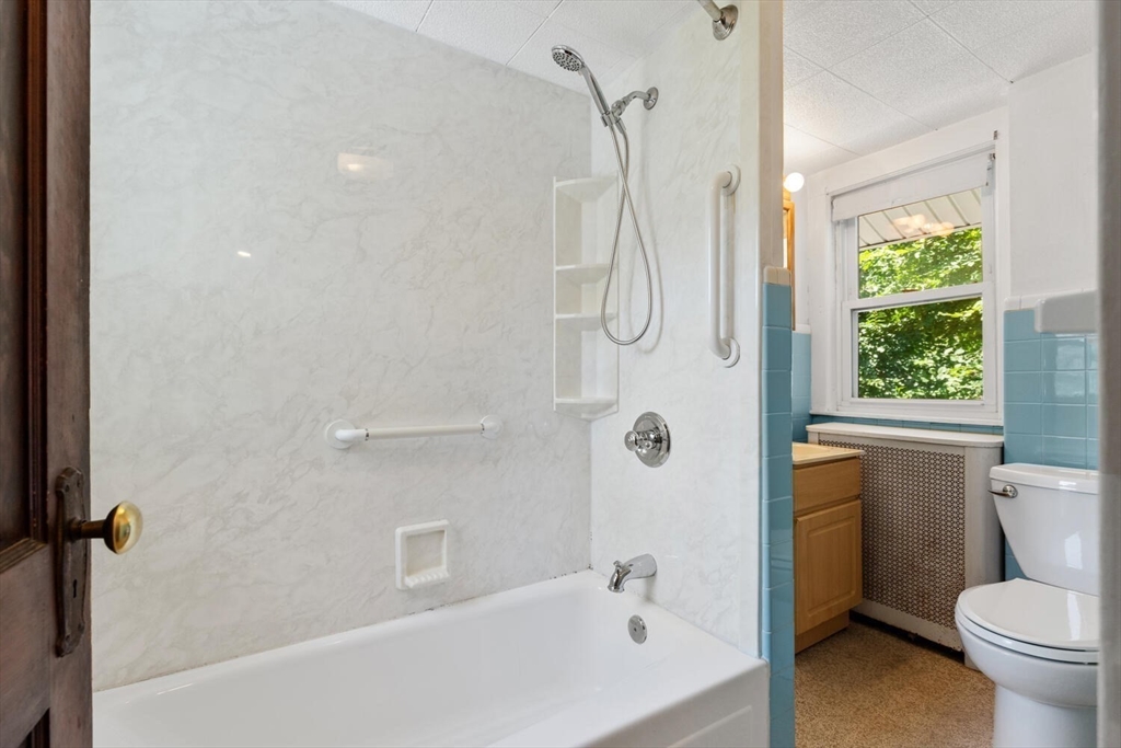 20 Marion Road Watertown, MA 02472 - Photo 26 of 33 a bathroom with a shower a toilet and a shower