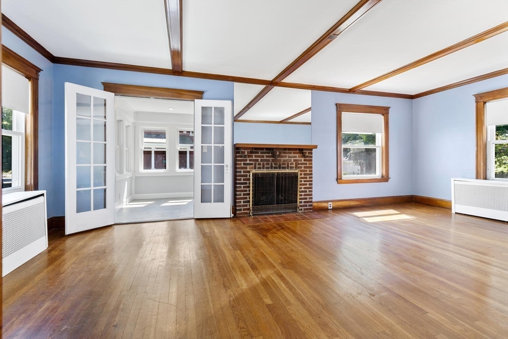 20 Marion Road Watertown, MA 02472 - Photo 6 of 33 a view of an empty room with wooden floor and a window
